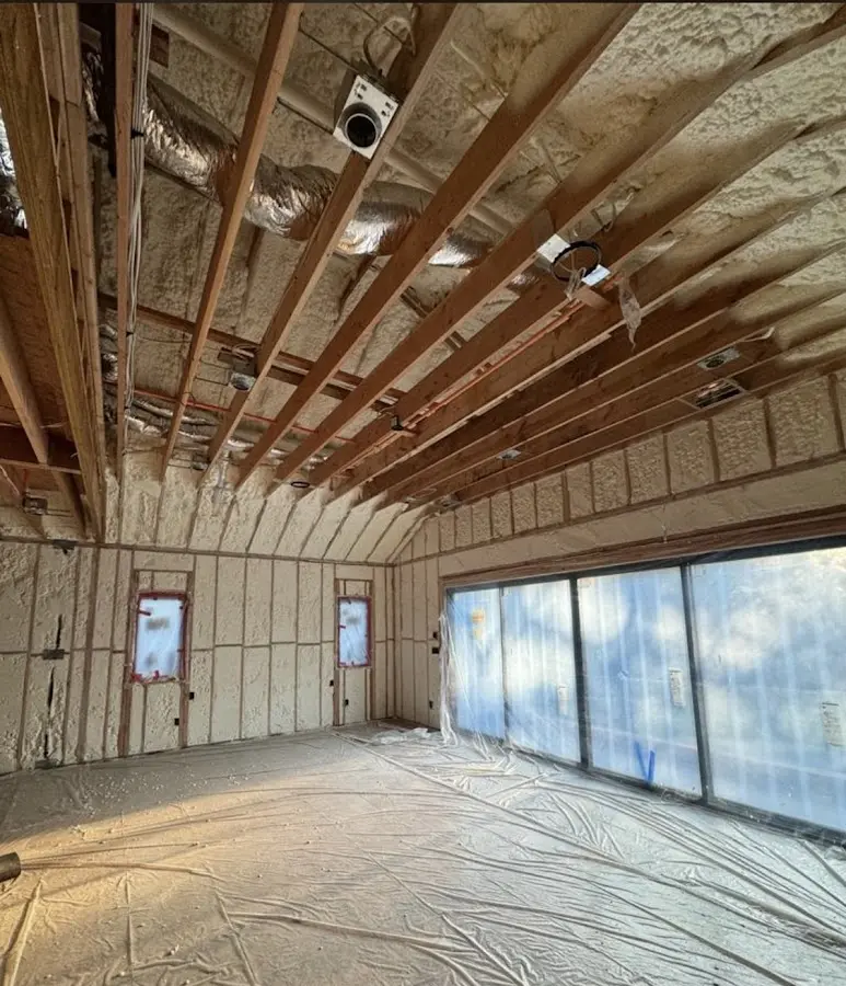 Interior walls and ceiling insulated with spray foam during new construction in Visalia